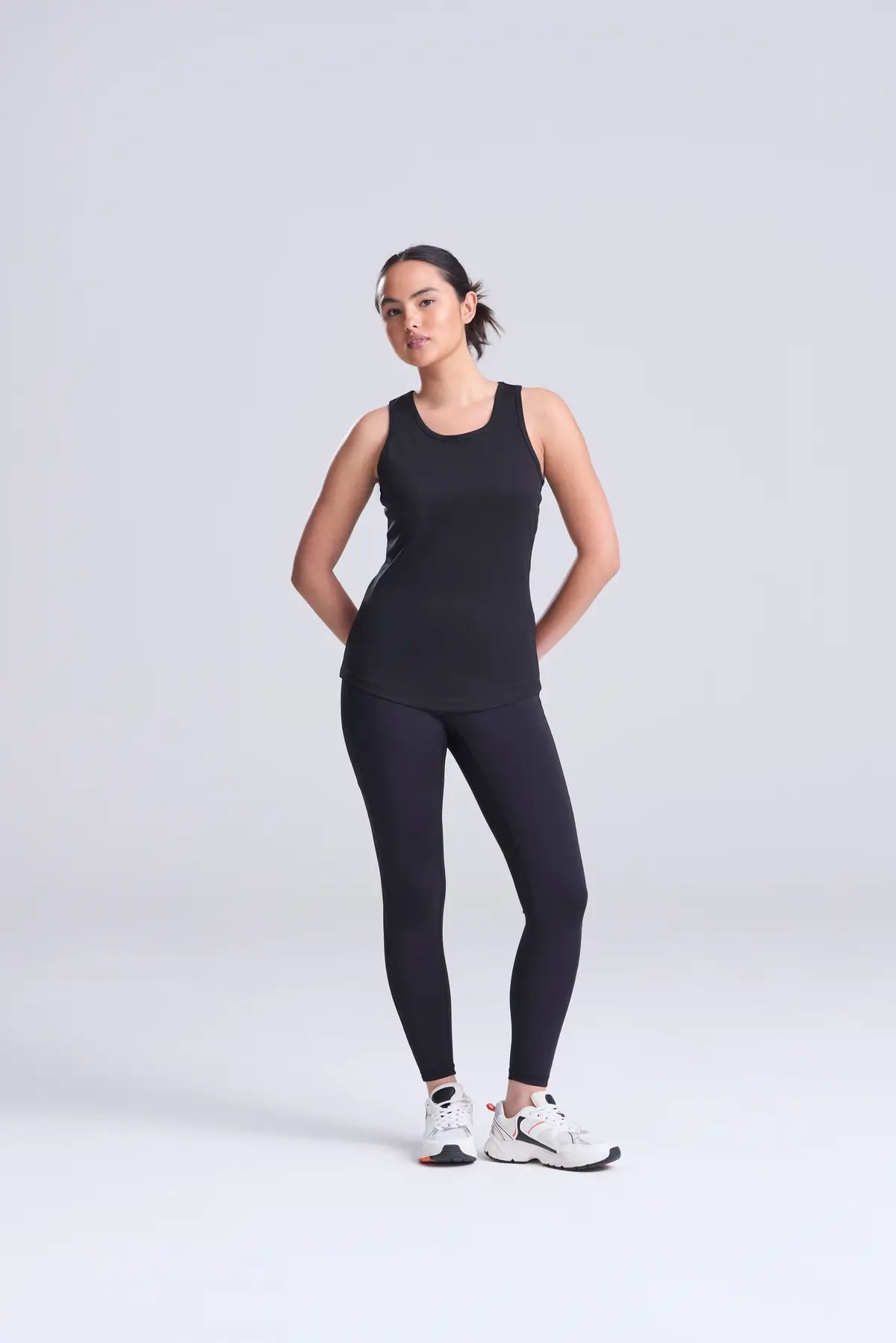 AWDis Just Cool Women's cool vest – Jet Black – Original on-model photograph 02