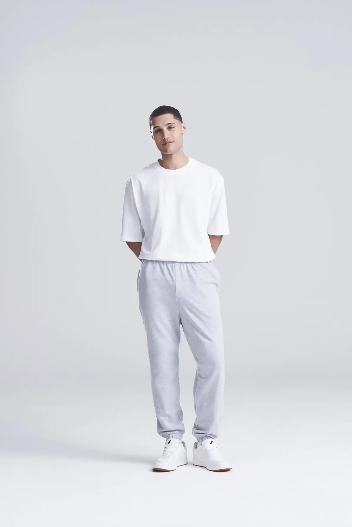 AWDis Just Hoods College cuffed sweatpants – Heather Grey – AWDis original on-model photograph