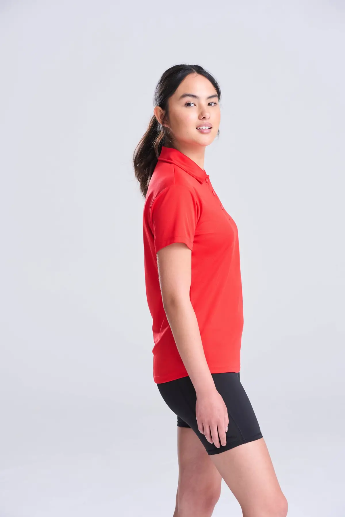AWDis Just Cool Women's cool polo – Fire Red – AWDis original on-model photograph