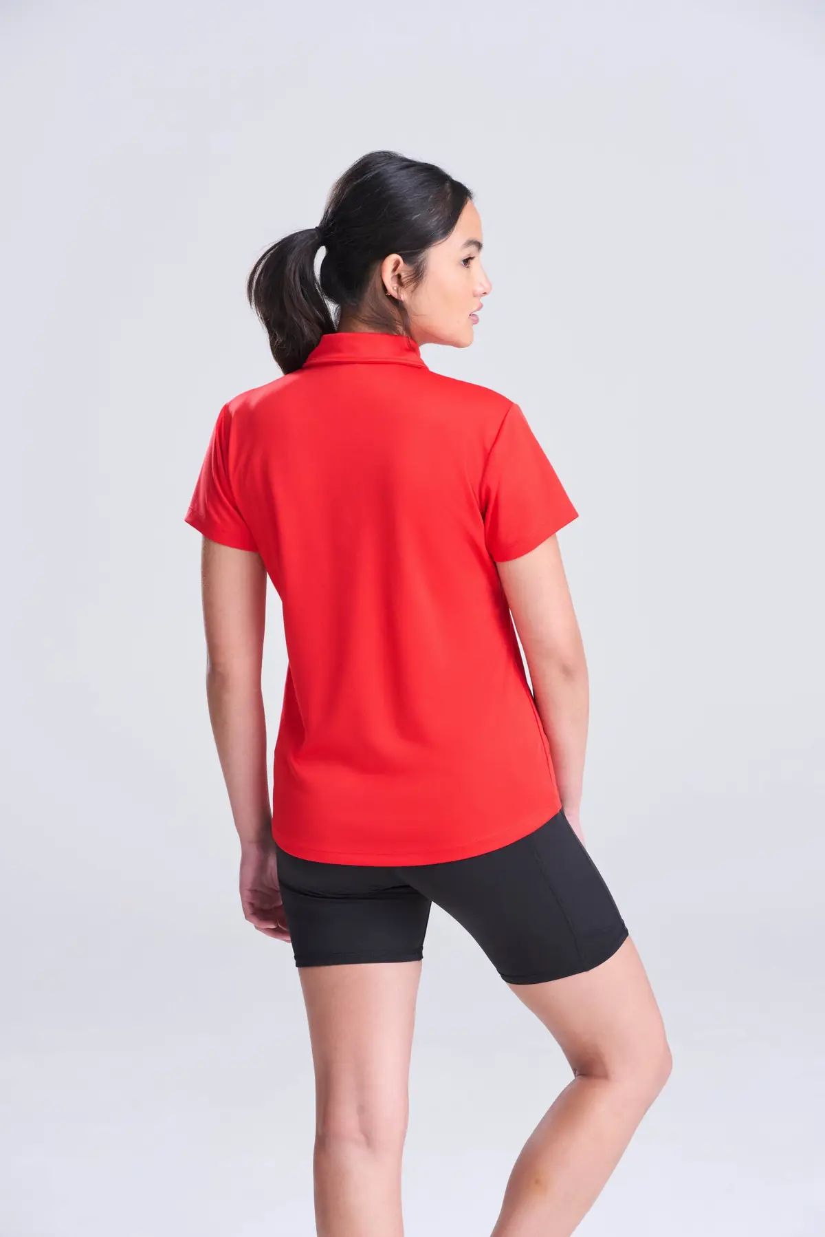 AWDis Just Cool Women's cool polo – Fire Red – AWDis original on-model photograph