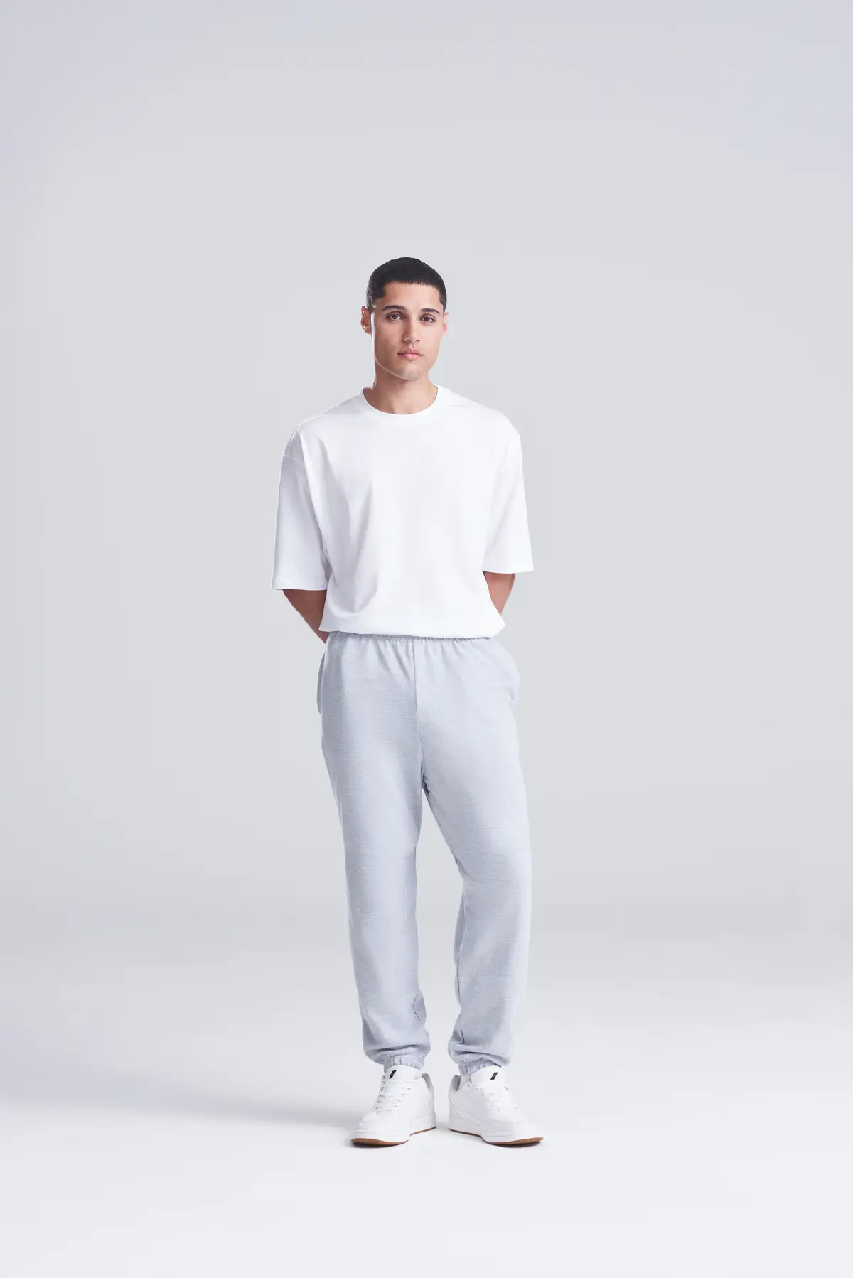 AWDis Just Hoods College cuffed sweatpants – Heather Grey – Original on-model photograph 00