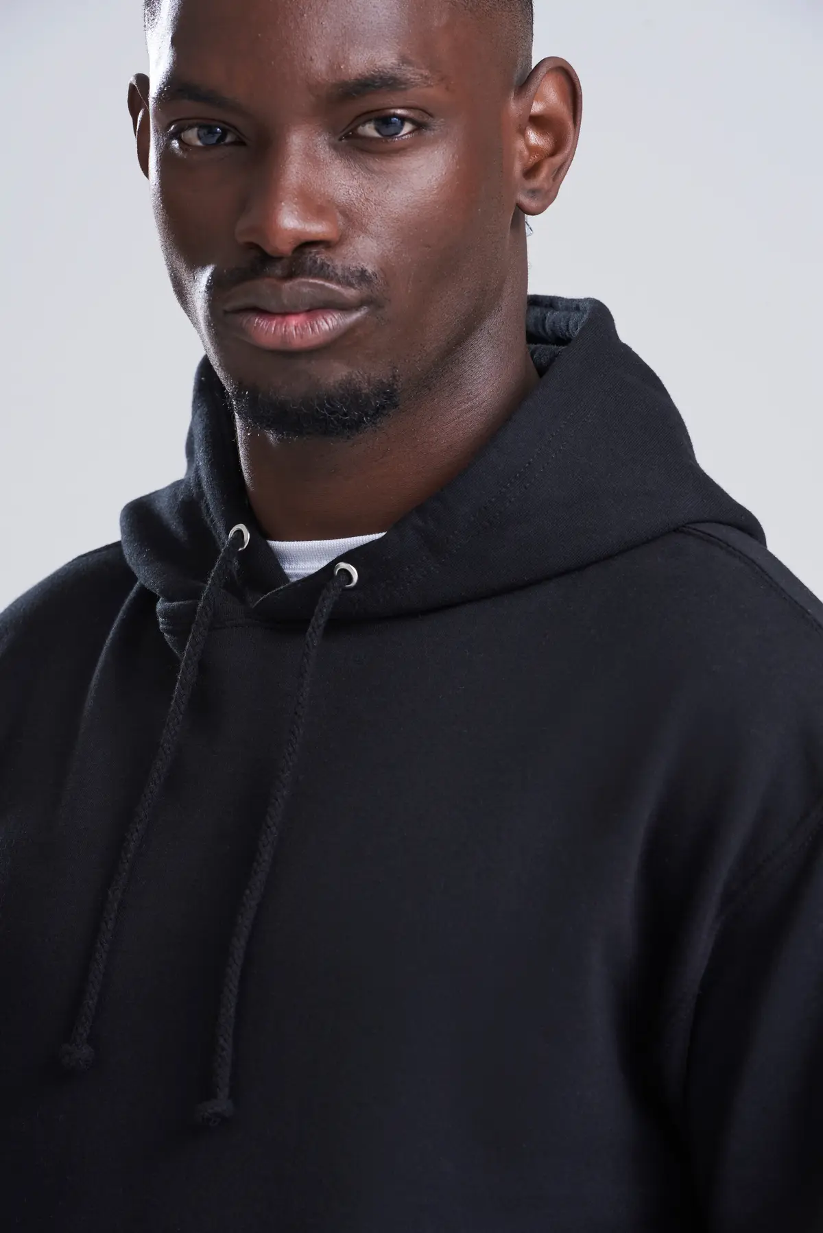 AWDis College Hoodie – Deep Black – Original on-model photograph 41