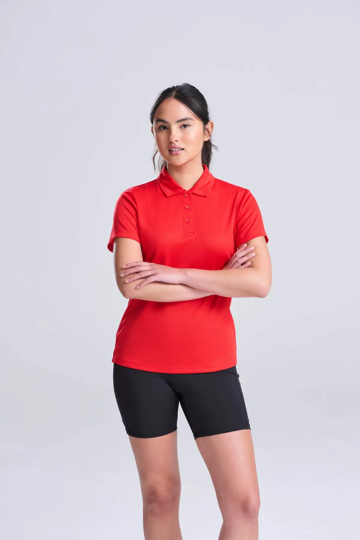 AWDis Just Cool Women's cool polo – Fire Red – AWDis original on-model photograph