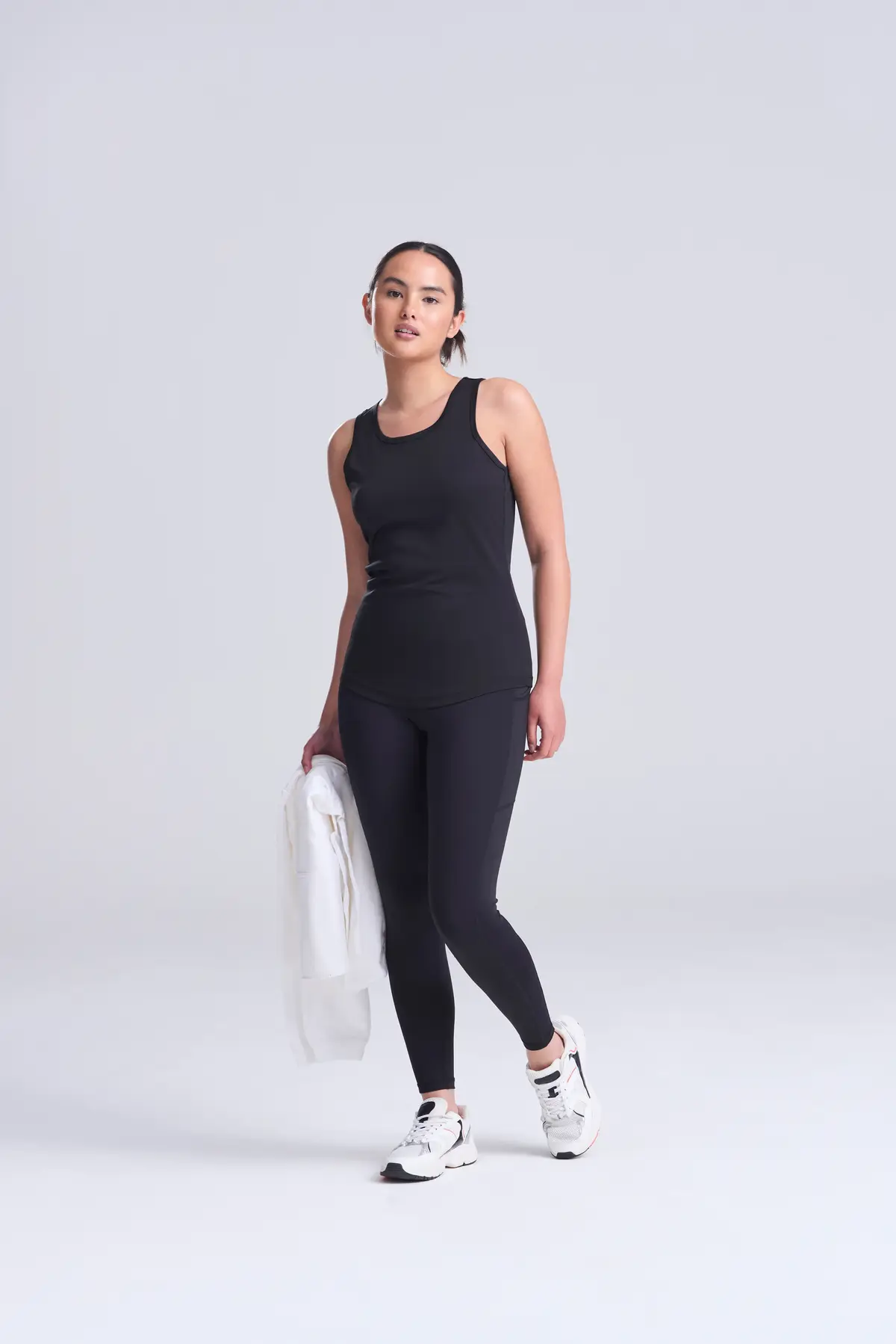 AWDis Just Cool Women's cool vest – Jet Black – Original on-model photograph 01