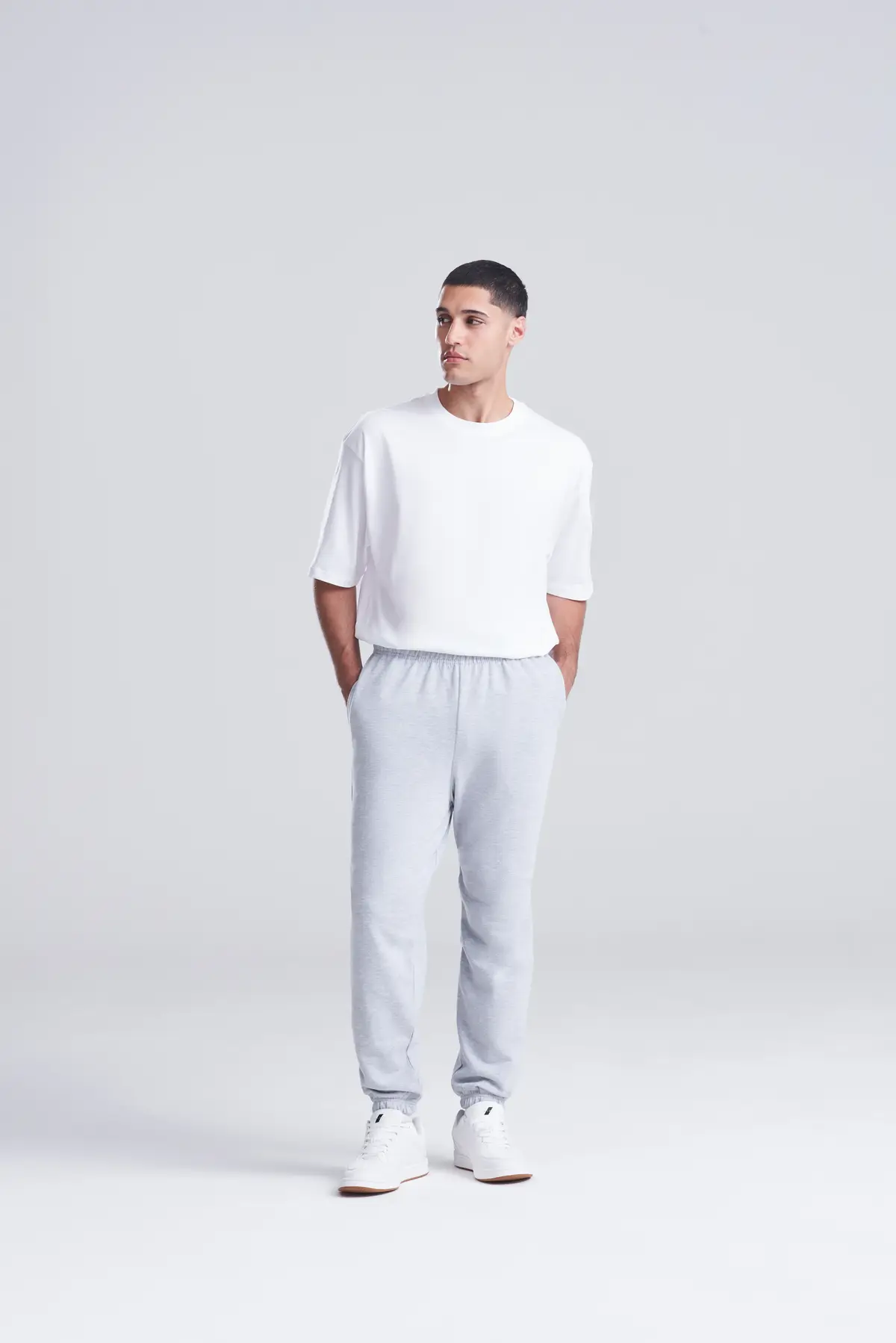 AWDis Just Hoods College cuffed sweatpants – Heather Grey – Original on-model photograph 01